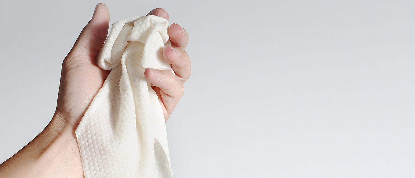 Cotton Wipe Crumpled in Hand