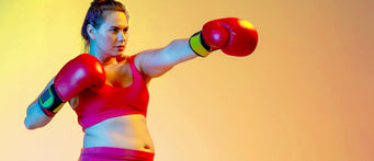 Girl with boxing gloves throwing a punch